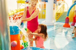 Mother/daughter playing at water park  on a cruise ship